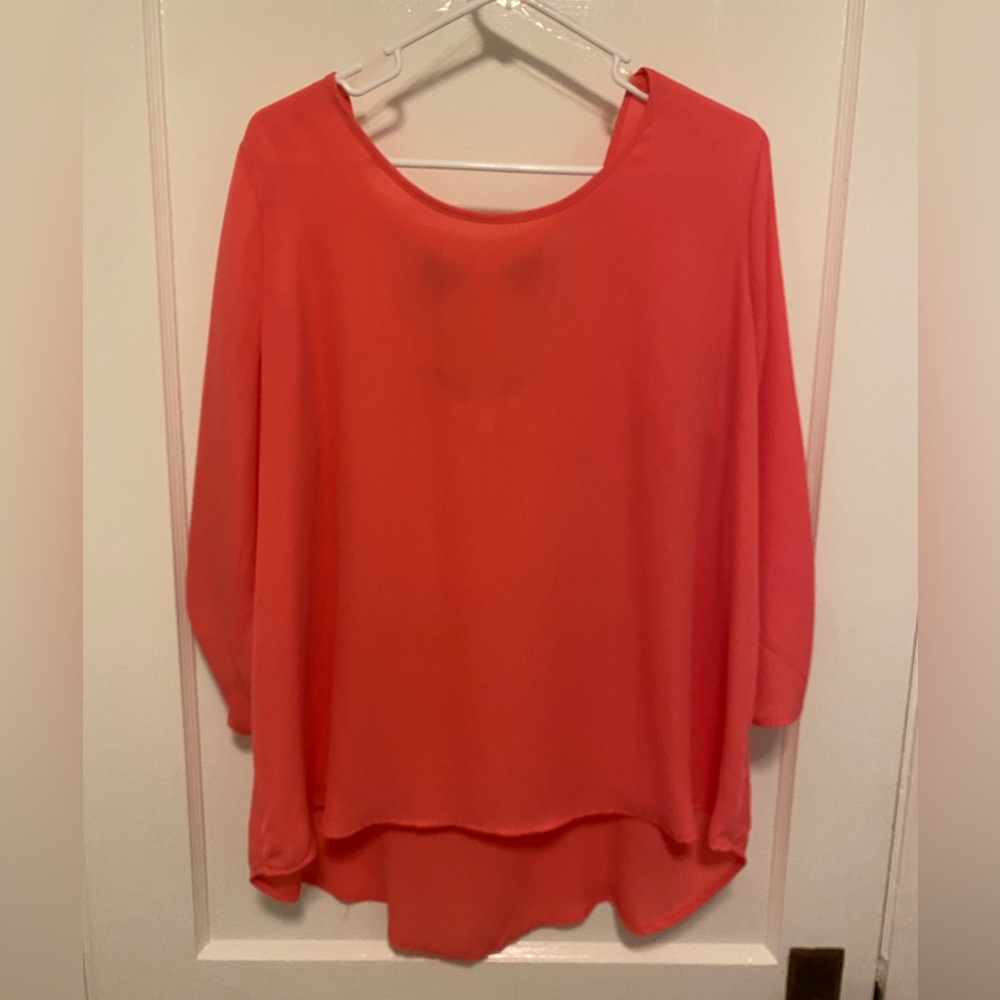 Coral shirt with black bows in back